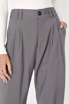 Per our last email, the Lulus Strictly Business Grey High-Waisted Trouser Pants are highly recommended for all boss babes! Lightweight woven twill creates a high waist (with a bit of elastic at the back), belt loops, and a brown marbled top button with a hidden zip fly. Pleated accents detail relaxed pant legs, with two diagonal pockets, that taper to ankle-length hems. Twin patch pockets at back. Fit: This garment fits true to size. Length: Ankle length. Size medium Inseam: 28.25 Front Rise: 13 Trendy Relaxed Fit Bottoms For Workwear, Solid Cotton Bottoms For Workwear, Chic Cotton Bottoms For Business Casual, Gray High Waist Wide Leg Pants For Business Casual, Tapered Work Pants With Elastic Waistband, Trendy Relaxed Fit Work Pants, Gray Wide Leg Pants With Belt Loops For Work, Solid Color Straight Chinos For Work, Straight Chinos For Workwear