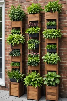 a tall wooden planter filled with lots of plants next to a brick wall covered in potted plants