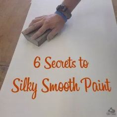 a hand on top of a white sheet of paper with the words 6 secrets to silky smooth paint