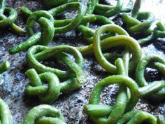 green peppers are being cooked on the grill