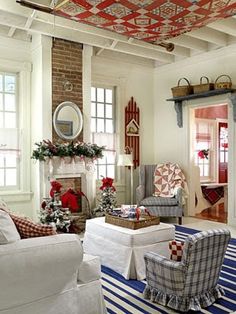 red and white living room decorated for christmas