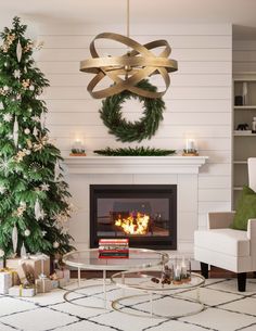 a living room with a christmas tree and fireplace