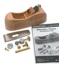 wooden plane hardware kit with instructions on the front and back side, including brass fittings