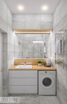 a washer and dryer in a bathroom with white tiles on the walls, along with a wooden counter top