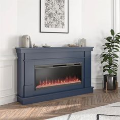 an electric fireplace in a living room next to a potted plant