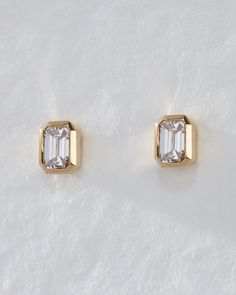 Add a touch of everyday chicness with our Bezel-Set Diamond Stud Earrings, featuring stunning emerald-cut diamonds available in two sizes, set in a sleek and minimalist bezel setting. Ideal for any lobe piercing, these earrings offer a comfortable fit and low maintenance wear thanks to the flat bezel setting. 1ct Diamond Earrings, Emerald Cut Diamond Earrings, Bezel Set Diamond Earrings, Emerald Cut Earrings, Yellow Gold Diamond Earrings, Bezel Set Earrings, Dazzling Earrings, Bezel Earrings, Emerald Cut Moissanite