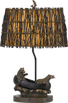 a lamp that is sitting on top of a wooden base with a dog laying down underneath it