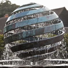 a fountain with water flowing from it's sides