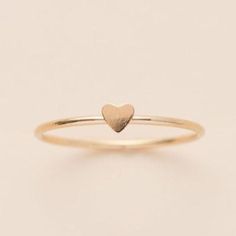 This heart ring adds an element of light and breezy to a stack. It can signify love and adoration for anyone in your life. We personally like to stack it with a birthstone & any another textured rings. Details:Location: Finger (order larger or smaller sizes depending on which finger you choose to wear it)Thickness: Band: 1mm Heart: 3.5mm(dainty)Sizes: 5,6,7,8Style: Minimalist/DaintyMade with: 14K Gold Filled Textured Ring, Stacking Ring, Stacking Rings, You Choose, Rose Gold Ring, Birthstone, Heart Ring, Gold Filled, Gold Rings