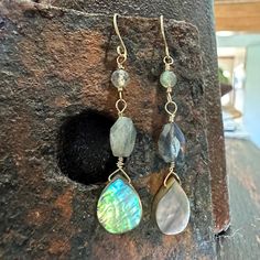 Labradorite and Abalone Earrings, Faceted Labradorite Teardrop Earrings with gold filled wires Details: Handmade item Approximately 2" drop (including ear wire) Materials: Gold Filled  Stone: Labradorite and Abalone Shell Caring for Gold Filled items is as easy as caring for any gold jewelry. Simply keep away from chemicals, clean regularly with mildly sudsy water, rinse well and pat dry with a non-scratching cloth. Polish gently with a jewelry polishing cloth. To do this, use a microfiber cloth Teardrop Labradorite Earrings, Wire Wrapped Labradorite Drop Earrings, Gold Labradorite Drop Earrings, Adjustable Dangle Labradorite Earrings, Faceted Labradorite Dangle Jewelry, Abalone Earrings, Bijoux Fil Aluminium, Special Jewelry, Abalone Shell