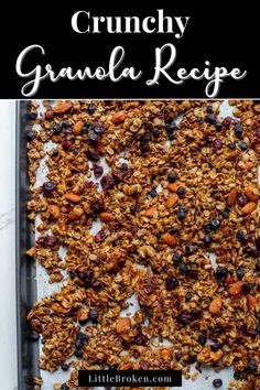 granola recipe with blueberries and cranberries on top in a baking pan