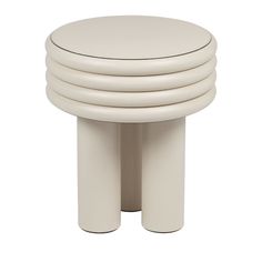 four white stools stacked on top of each other in front of a white background