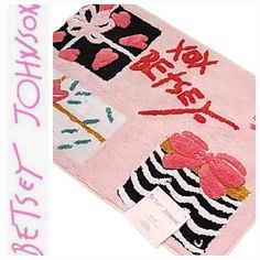 a pink rug with pictures and words on it, along with the word best mom written in chinese