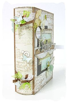 a close up of a small box with flowers on the front and back side,