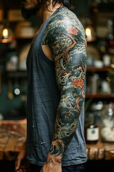 a man with a dragon tattoo on his arm