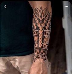 a man with a tattoo on his arm