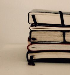 a stack of books sitting on top of each other