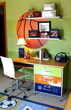 a room with a basketball on the wall and a desk in front of it,