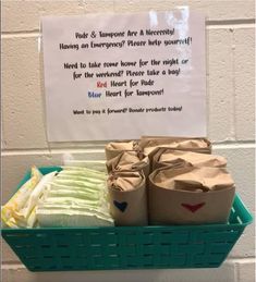 a basket filled with lots of diapers next to a sign