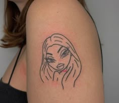 a woman's shoulder with a black and white drawing of a girl on it