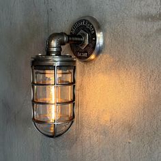 an old fashioned wall light on the side of a building with no bulbs or wires