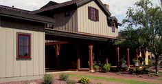 a large house with landscaping in front of it