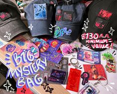 several hats, stickers and other items are laid out on top of a table