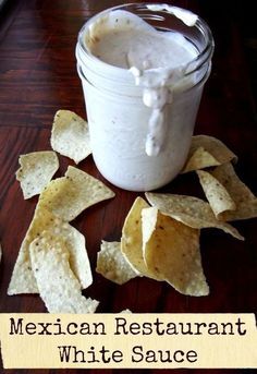 mexican restaurant white sauce with tortilla chips on the side and in a jar