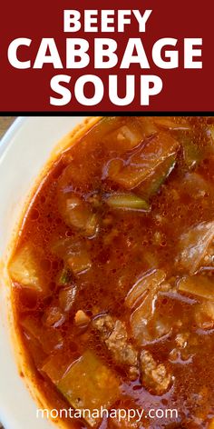 beefy cabbage soup in a white bowl on a wooden table with text overlay