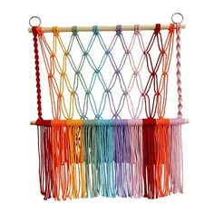 a multicolored macrame hanging on a wall