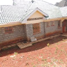 a house that is sitting in the dirt