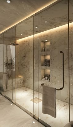 an elegant bathroom with marble walls and flooring