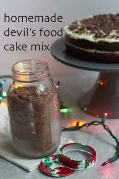 homemade devil's food cake mix in a glass jar next to a christmas decoration