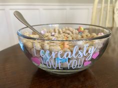 a bowl filled with cereal sitting on top of a wooden table