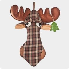 a stuffed animal with large antlers and plaid shirt on it's head, hanging from a string