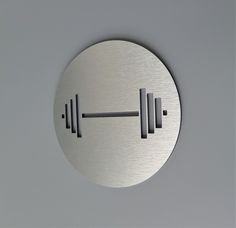 a round metal object with two bars on it's side and one bar at the top