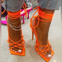 Shane Justin Strappy Lace Up Heels New . Super Cute . Knotted Detail . Strappy Lace Up . New Without Box . Squared Toe . Bright Orange . Neon . Size 37 . 7 Usa . Heel 5 Inch . Black Dress With Orange Heels, Orange Heels For Spring Night Out, Orange Lace-up Heels For Party, Orange Strappy Heels With Heel Strap, Orange Strappy Heels With Wrapped Heel, Trendy Orange Heels With Wrapped Heel, Orange Strappy Heels For Spring, Orange Lace-up Summer Heels, Orange Lace-up Heels For Summer