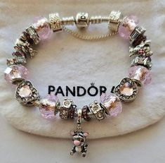 AUTHENTIC Pandora Barrel Clasp or Heart Clasp Bracelet These are purchased from Jared Jewelers and come with a receipt. While I use high quality beads and charms on the Pandora bracelet, the charms and beads used on the bracelet are NOT Pandora Brand, making the bracelet very affordable. #1  Beads and Charms include: Pink Single core diamond faceted beads, pink crystal heart beads, Tigger beads, Silver Plated Tigger Charm, crystal bead Includes Heart Security Chain, Heart Clasp Bead, Gift box and ships USPS Priority Mail Real Pandora Bracelet, Pandora Charms Aesthetic, Pandora Bracelet Aesthetic, Pink Pandora Bracelet, Body Jewelry Diy