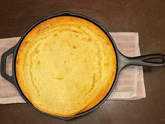 a cast iron skillet sitting on top of a table