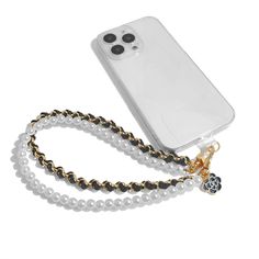 a cell phone with a gold chain attached to it's back and white case