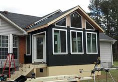 a house being built in the process of being remodeled with windows and siding on the side