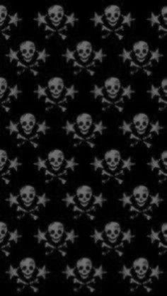 black and white skulls with crossbones are seen in this pattern on the wall