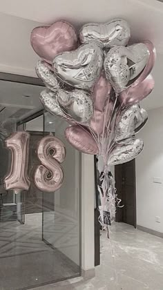 a bunch of balloons that are in the shape of the number twenty eight and some type of balloon