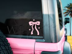 a pink jeep with a bow and stars decal