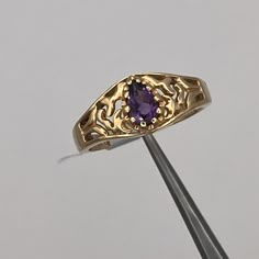 ITEM DESCRIPTION NEW 14K YELLOW GOLD FILIGREE PEAR AMETHYST RING, SIZE 6.25 Gender - Female Size - 6.25 Stone Type - 1 Pear Amethyst .37 cw Width - 2mm Shank Weight - 3.2Grams Markings - 14K Condition - New with Tag Additional Info Return Policy We stand behind every item we sell with a full 30-day, 100% money back guarantee! As a courtesy, please notify us of any return. Shipping Always fast & free unless otherwise stated. All items are shipped in our one-day handling time period (after payment is received & excluding weekends). Contact us for international shipping options. Gold Ring With Amethyst, Pearl And Amethyst Ring, Dark Purple Ring, Purple And Gold Ring, Gold And Amethyst Ring, Engagement Rings Amethyst, Amethyst Engagement Ring Vintage, Amethyst Jewelry Ring, Vintage Amethyst Ring