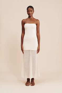 Our antique-inspired Romy Strapless Dress is crafted from the softest viscose blend in a crochet knit. Designed for a close fit, it features an elegant square neckline and floaty hem adorned with scalloped trims. The subtle cream hue makes it perfect for a memorable bridal moment. Tell Me More Antique inspired crochet knit Strapless style Elasticated bust Scallop edge hemline Over the head entry Strapless bra friendly Fit Notes LZ is 5'7", 120 lbs. & wears size XS Fits true to size, take your no Tell Me More, Scallop Edge, Dress Cream, Antique Inspiration, Cream Dress, Strapless Bra, Denim Pant, Square Neckline, Denim Skirt