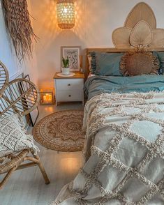 a bed room with a neatly made bed and wicker furniture on the floor next to a night stand