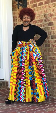 "What a beautiful garment!  You can wear this skirt for business, pleasure any anything in between.  Pair this skirt with a blouse, t-shirt, jean jacket or blazer for an attention grabbing look.  This skirt has an elastic waist band, pockets, sash and fits sizes 4-24.   Maxi Skirt - 43\" to 45\" Midi Skirt - 27\" to 29\" High Low Skirt - Back of the skirt will be a maximum of 45\" (customer to provide length of skirt front) One week prior to processing the order, an email will be sent to the customer for fabric selection. NOTE--- I have many prints to choose from and can make this style in a print of your choosing. Just convo me for print options.  The fabric shown on the model is for illustration purposes only." African Print Midi Skirt, Skirt African Print, Stil Rock, Denim Clutch, African Print Skirt, African Skirts, African Prom Dresses, Ankara Skirt, Maxi Rok