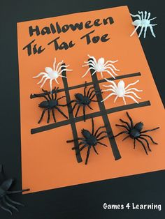 an orange card with black and white spideres on it that says halloween the tat toe