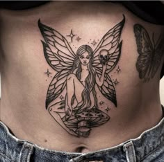 a woman's stomach with a fairy tattoo on her belly and two butterflies flying around